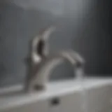 Close-up of a leaking bathroom sink faucet with water droplets