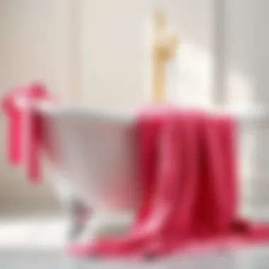 Luxurious Hot Pink Bath Towel Luxurious hot pink bath towel draped elegantly over a freestanding bathtub