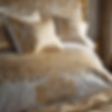 Close-up of elegant gold and white bedding with intricate patterns